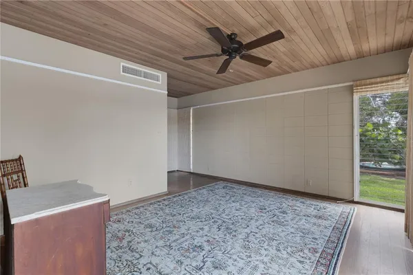 a view of balcony with wooden floor