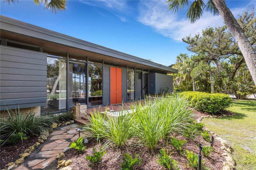 62 Sandy Hook Road South Sarasota, FL 34242 - Photo 34 of 66 a front view of a house with a yard