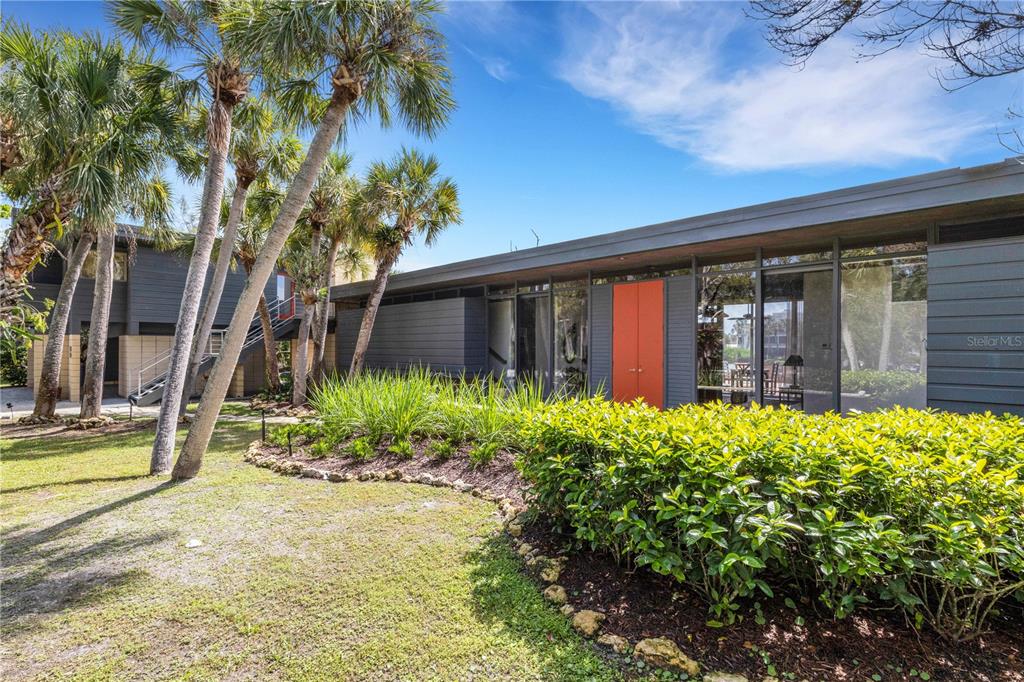 62 Sandy Hook Road South Sarasota, FL 34242 - Photo 35 of 66 a front view of a house with garden