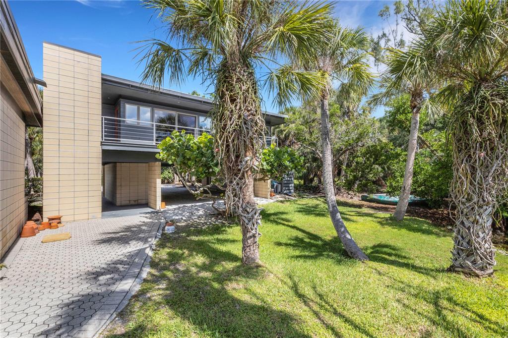 62 Sandy Hook Road South Sarasota, FL 34242 - Photo 42 of 66 a view of a house with swimming pool and sitting area