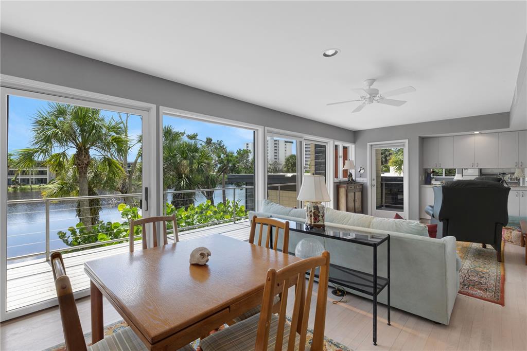 62 Sandy Hook Road South Sarasota, FL 34242 - Photo 51 of 66 a view of a dining room with furniture window and outside view