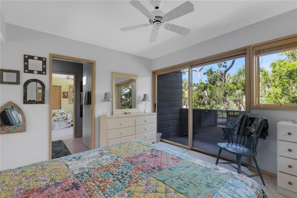 62 Sandy Hook Road South Sarasota, FL 34242 - Photo 56 of 66 a bed room with a bed and a dresser