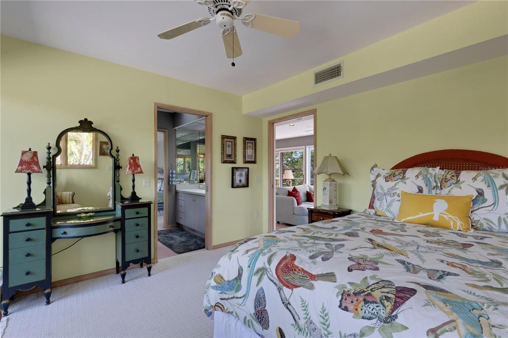 62 Sandy Hook Road South Sarasota, FL 34242 - Photo 60 of 66 a bedroom with a bed and cabinets