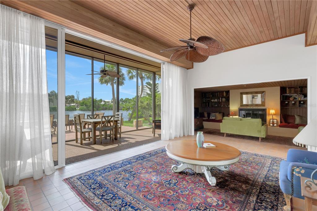 62 Sandy Hook Road South Sarasota, FL 34242 - Photo 9 of 66 a living room with furniture a rug and a large window