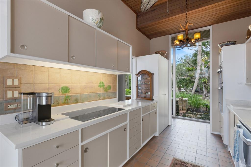 62 Sandy Hook Road South Sarasota, FL 34242 - Photo 10 of 66 a kitchen with a sink and refrigerator