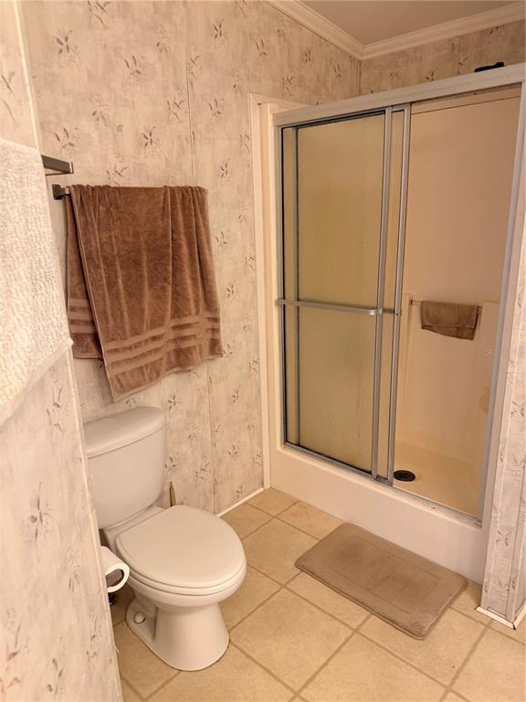 33 Ridge Road Frostproof, FL 33843 - Photo 14 of 21 a bathroom with a toilet and a shower