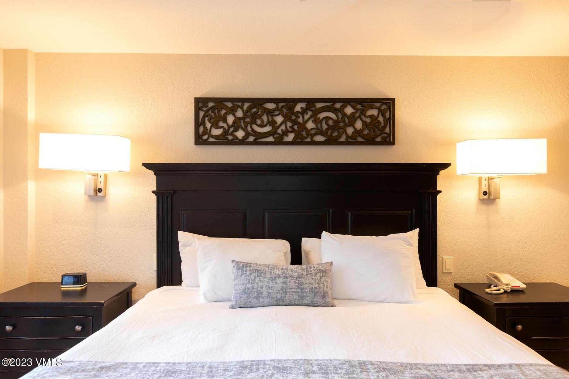 210 Offerson Road, Unit R112/ WEEK 38 Beaver Creek, CO 81620 - Photo 11 of 19 a bedroom with a bed and a night stand