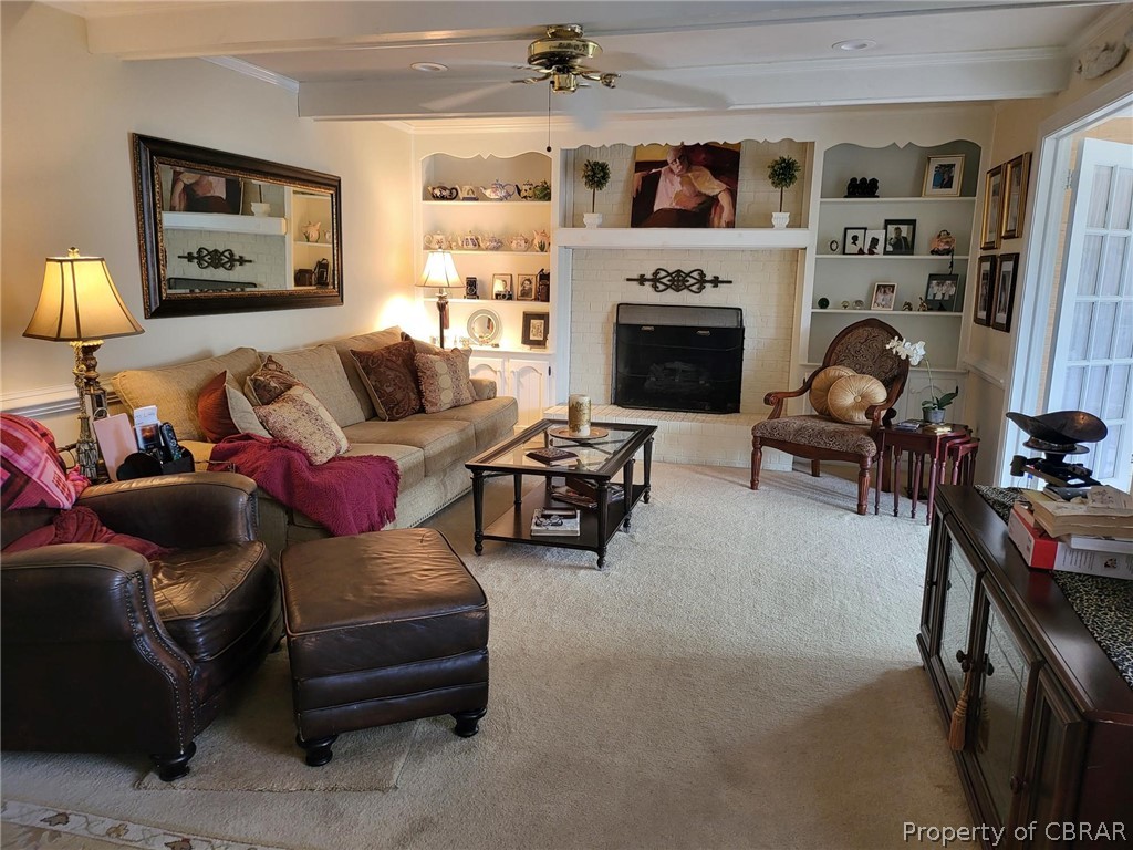 2449 Everglades Road Norfolk, VA 23518 - Photo 12 of 31 a living room with furniture a fireplace and a flat screen tv