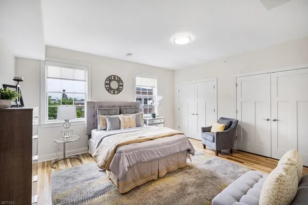 a bedroom with a bed and furniture