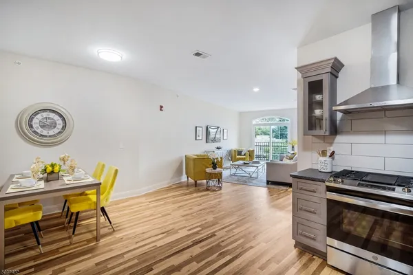 a kitchen with a table and chairs in it
