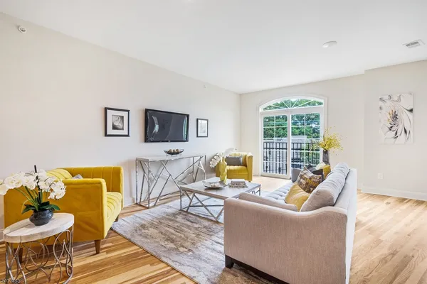 a living room with furniture and a large window