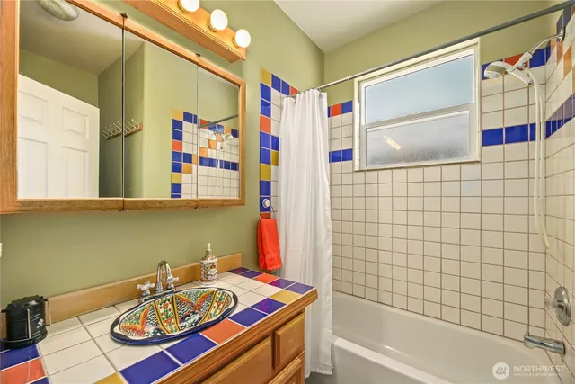 a bathroom with a sink and a bathtub