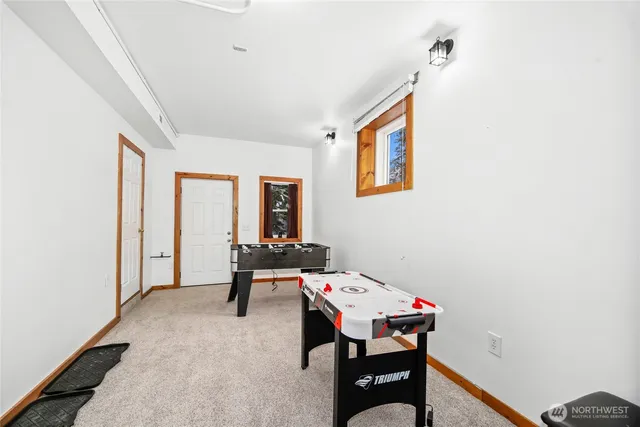 a reading room with furniture and wooden floor