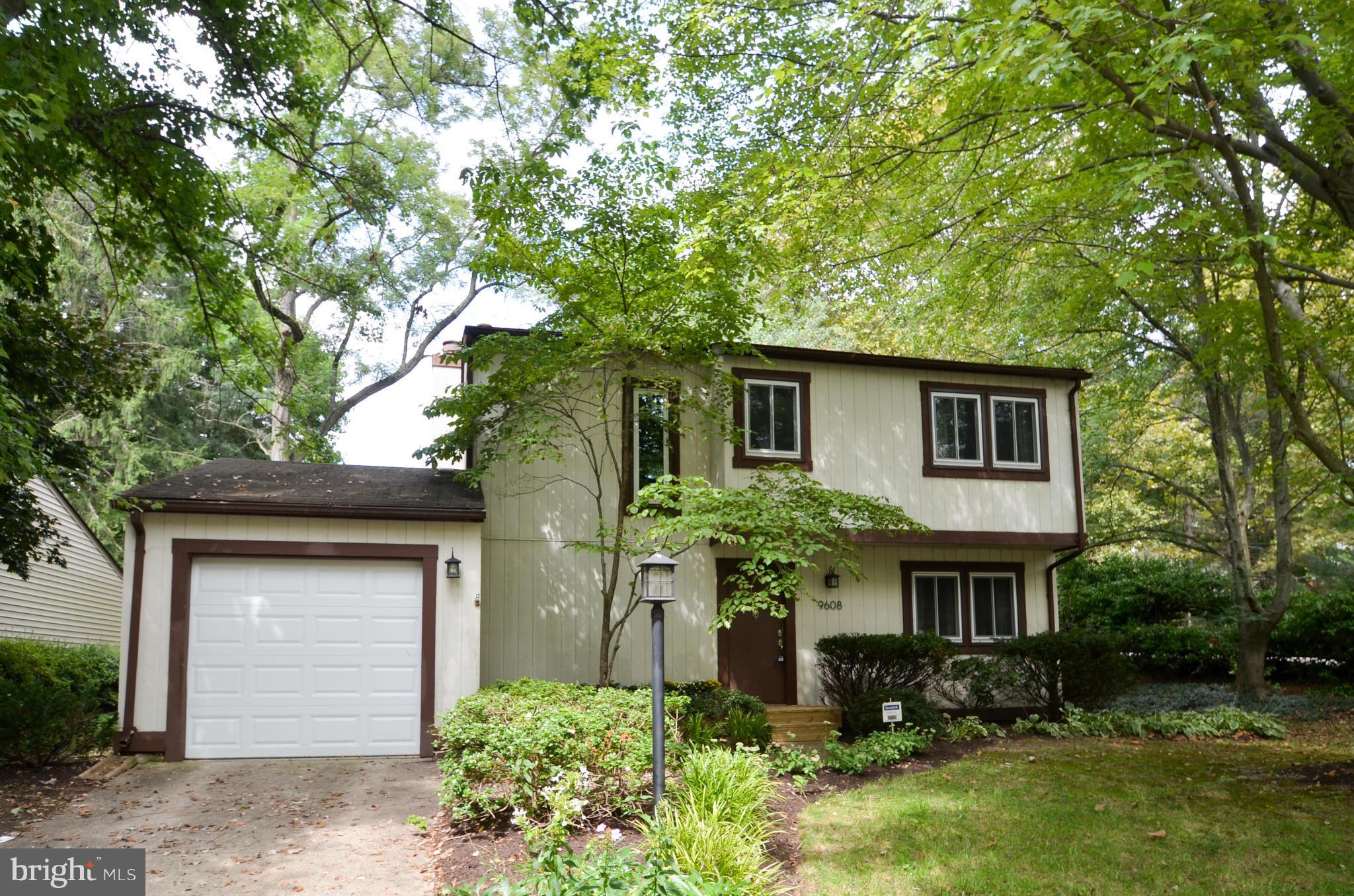 9608 Rocksparkle Row Columbia, MD 21045 - Photo 1 of 29 a front view of house with a garden