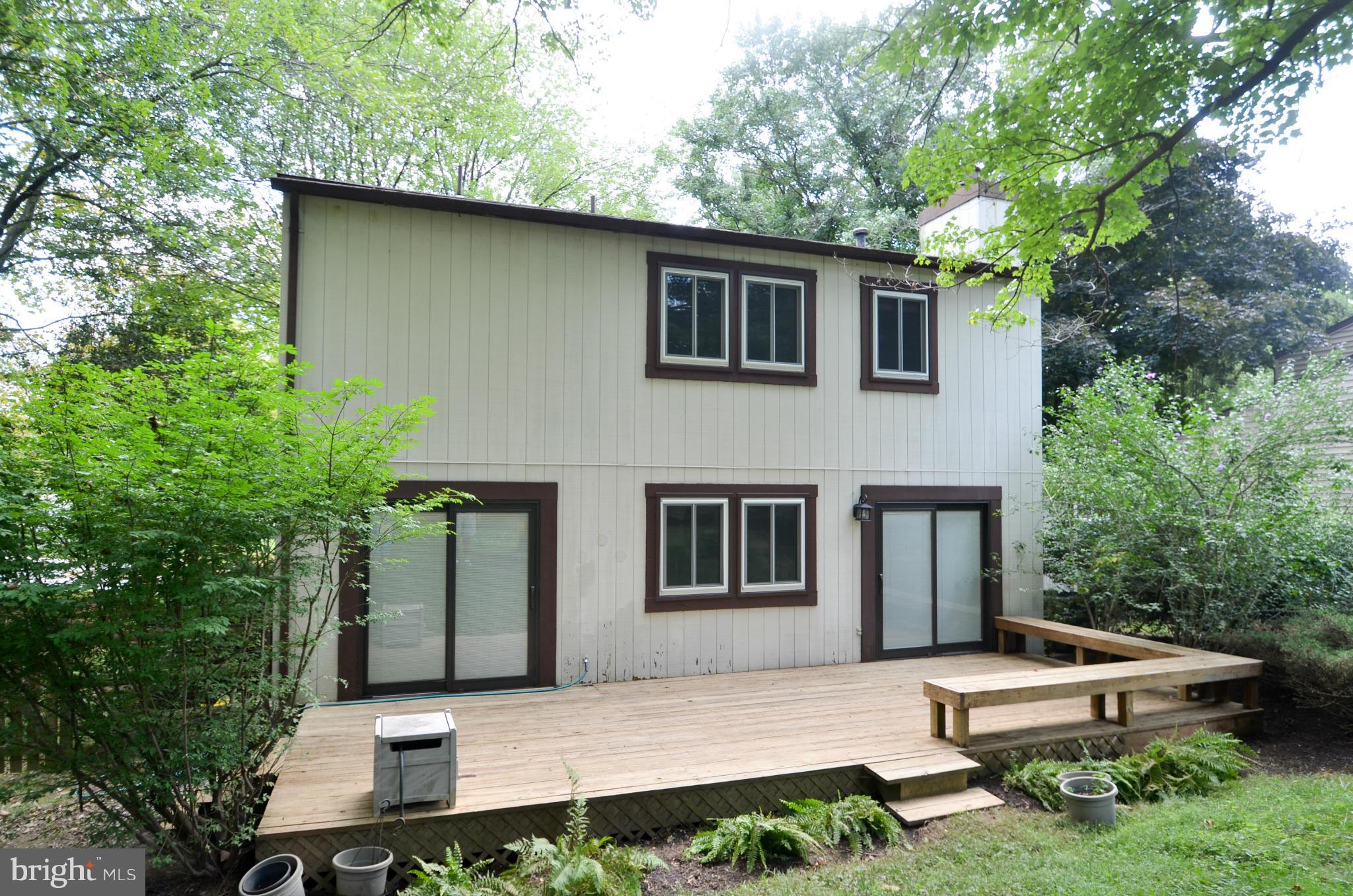 9608 Rocksparkle Row Columbia, MD 21045 - Photo 22 of 29 a view of house with yard and sitting area