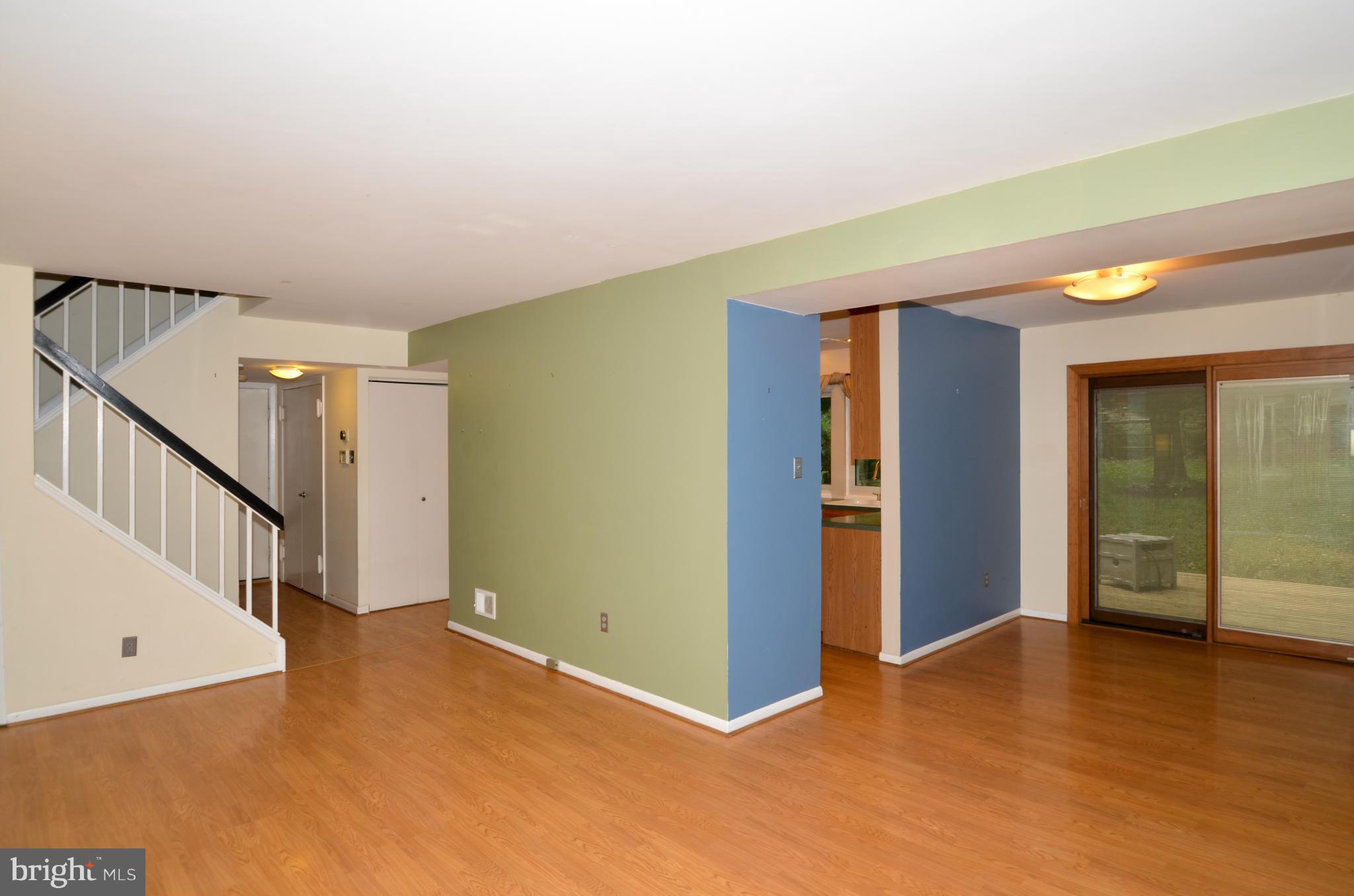 9608 Rocksparkle Row Columbia, MD 21045 - Photo 4 of 29 a view of an empty room with window and stairs