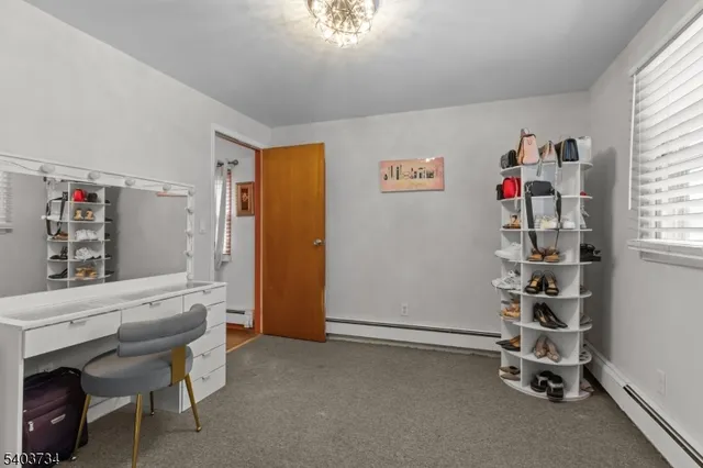 a view of a livingroom with furniture and window