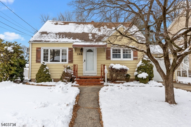 148 Locust Drive Union, NJ 07083 - Photo 2 of 34 a view of a house with snow in the yard