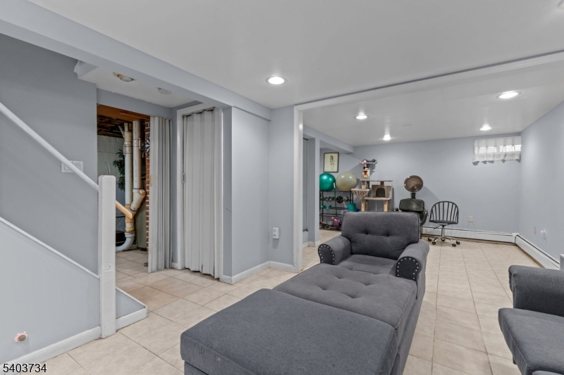 148 Locust Drive Union, NJ 07083 - Photo 21 of 34 a living room with furniture and a couch