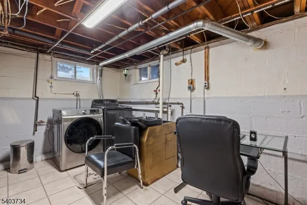 a utility room with lots of chairs and mirrors