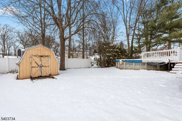 a view of roof deck with large trees