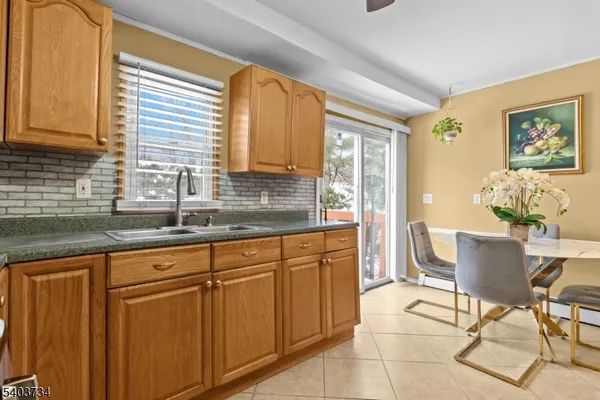 a kitchen with stainless steel appliances granite countertop a sink and cabinets