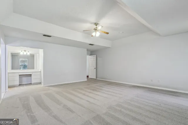 a bathroom with a sink vanity granite tub and shower