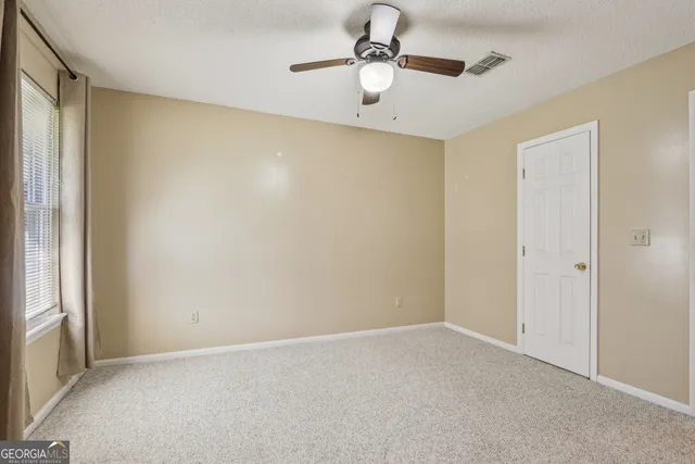 a view of swimming pool with seating space