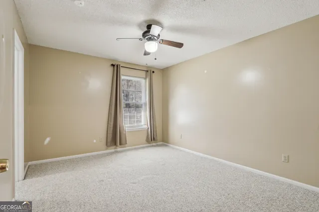 a chair and table sitting on wooden deck