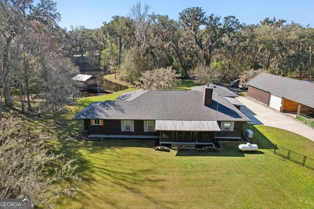 aerial view of a house with a ocean view