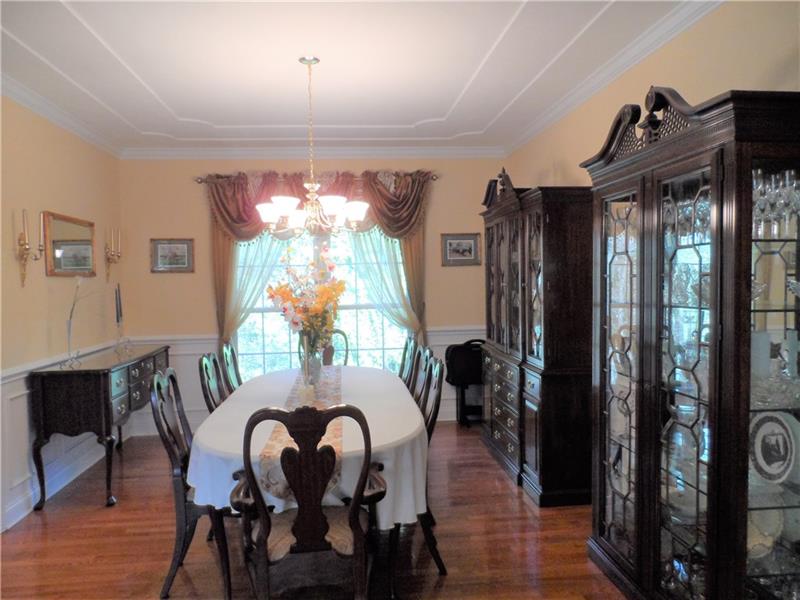 Formal Dining Room, hardwood flooring, tray ceiling, wainscoting
