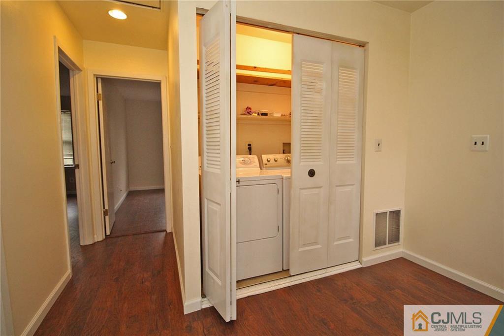 6106 Hana Road Edison, NJ 08817 - Photo 22 of 25 a view of a bathroom with wooden floor