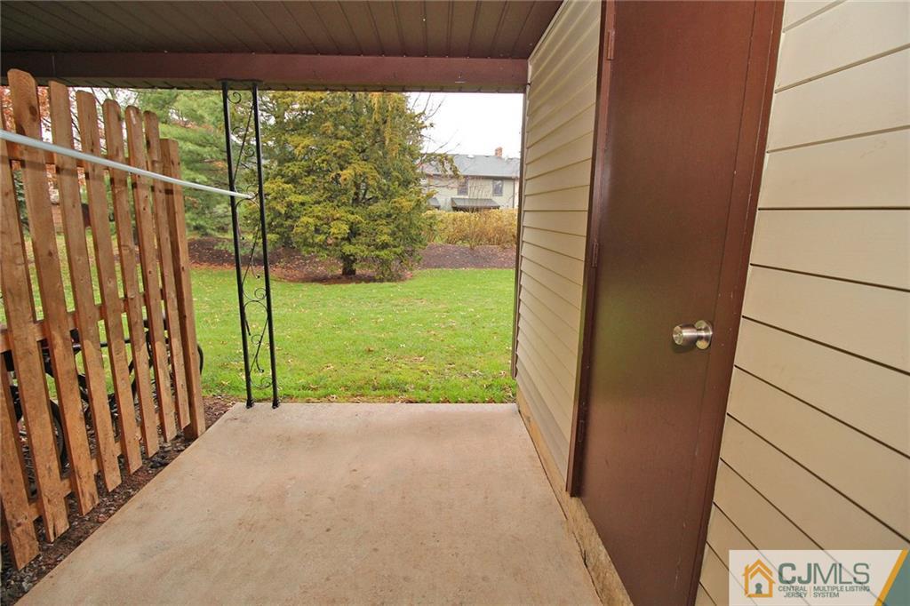 6106 Hana Road Edison, NJ 08817 - Photo 23 of 25 a view of a porch with a yard