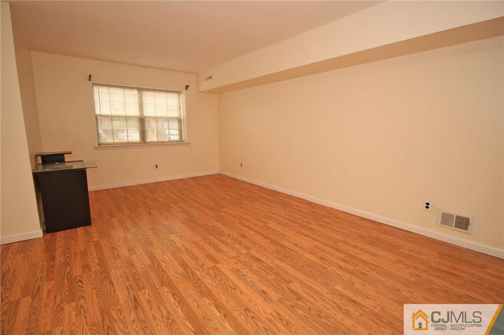 6106 Hana Road Edison, NJ 08817 - Photo 7 of 25 a view of an empty room and window