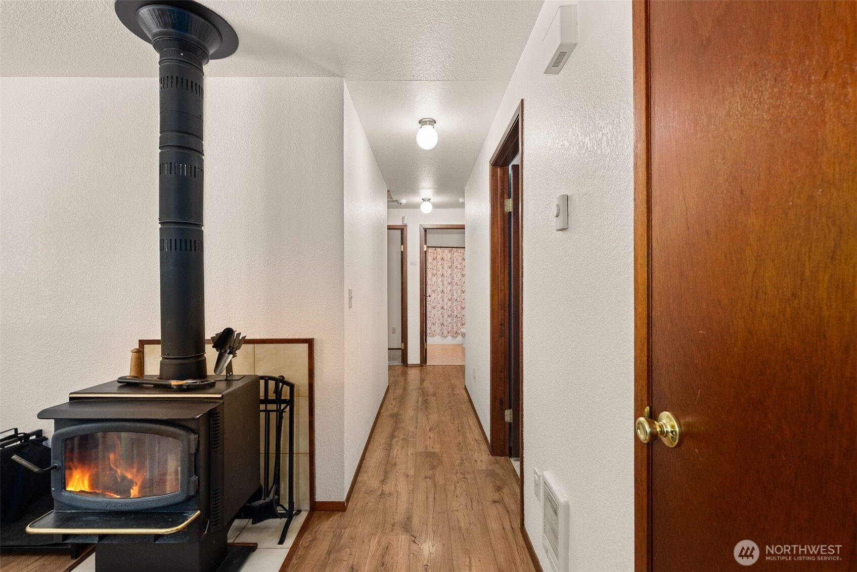 119 River Heights Road Centralia, WA 98531 - Photo 14 of 40 a view of a hallway with wooden floor and staircase
