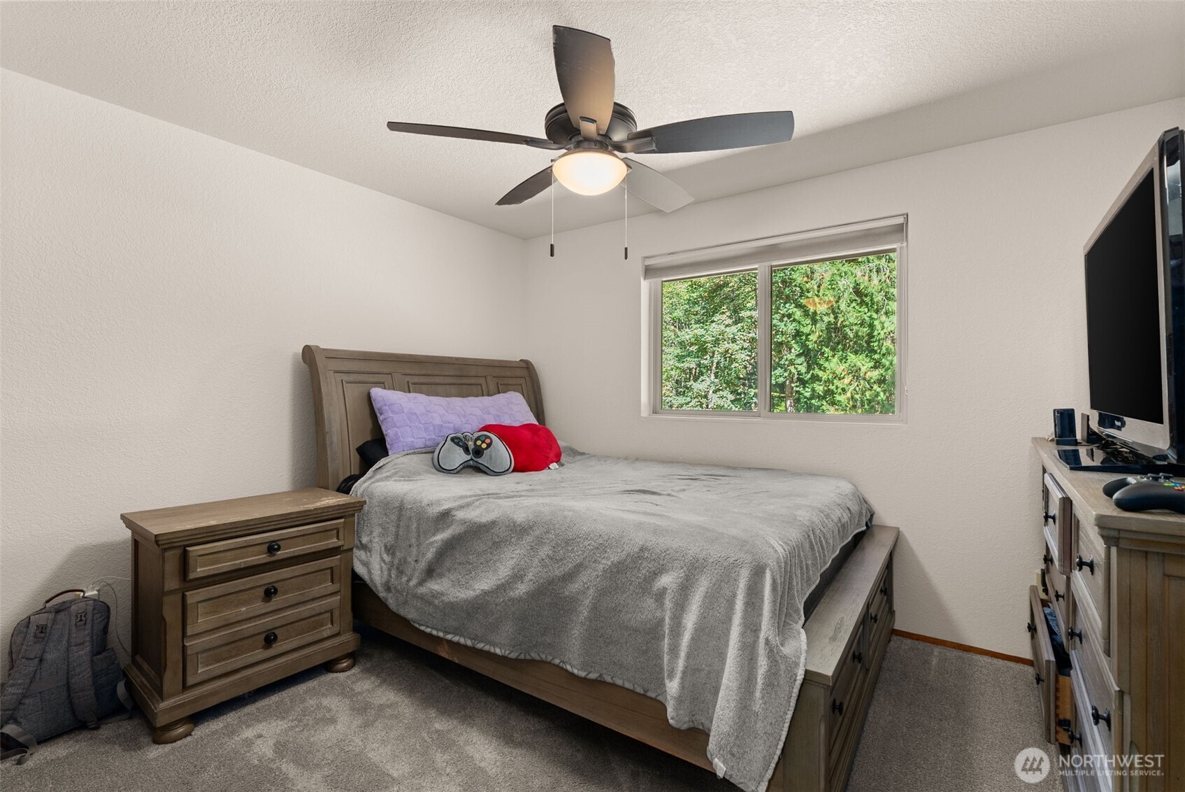 119 River Heights Road Centralia, WA 98531 - Photo 19 of 40 a bedroom with a bed and a flat screen tv