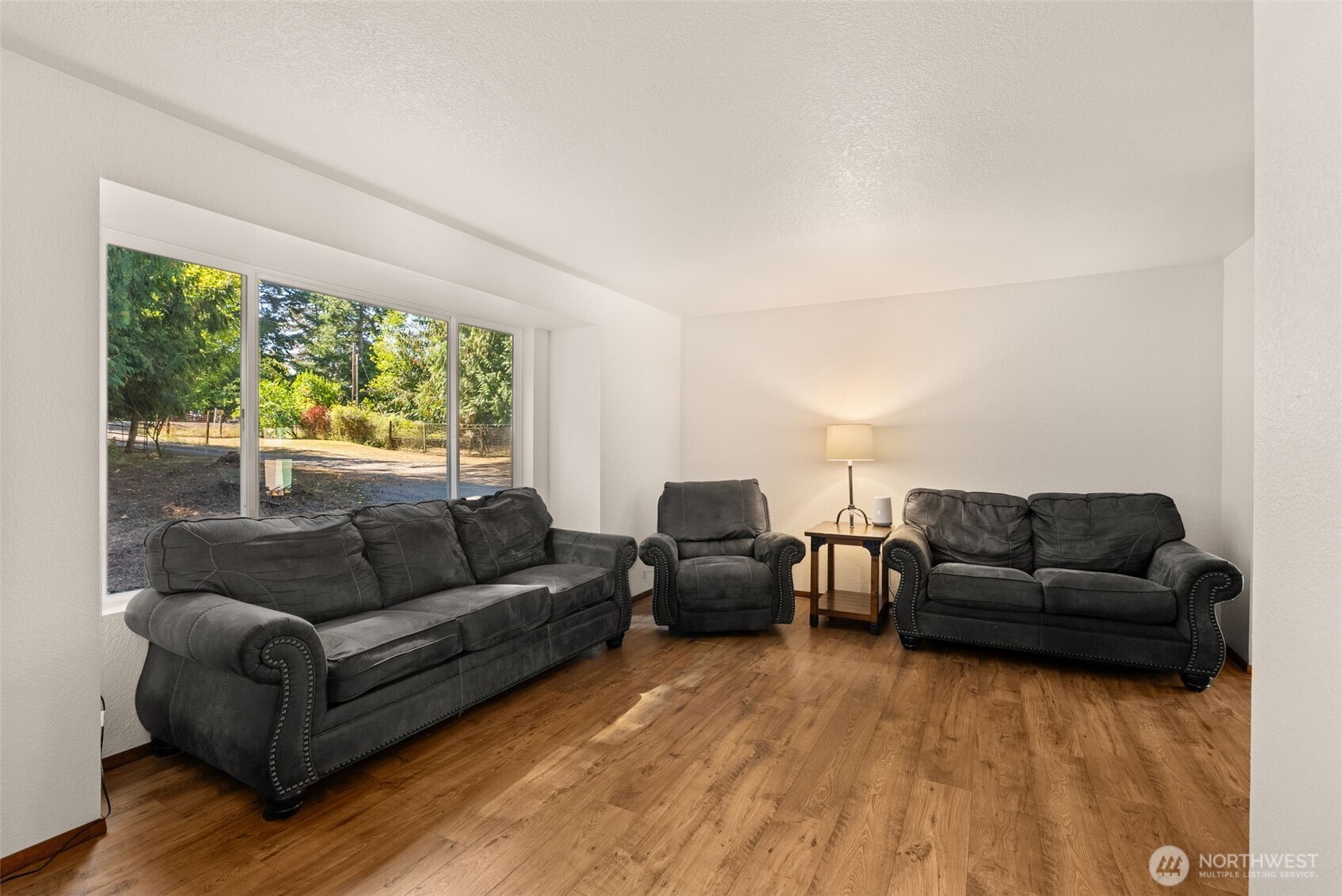 119 River Heights Road Centralia, WA 98531 - Photo 7 of 40 a living room with furniture and a large window