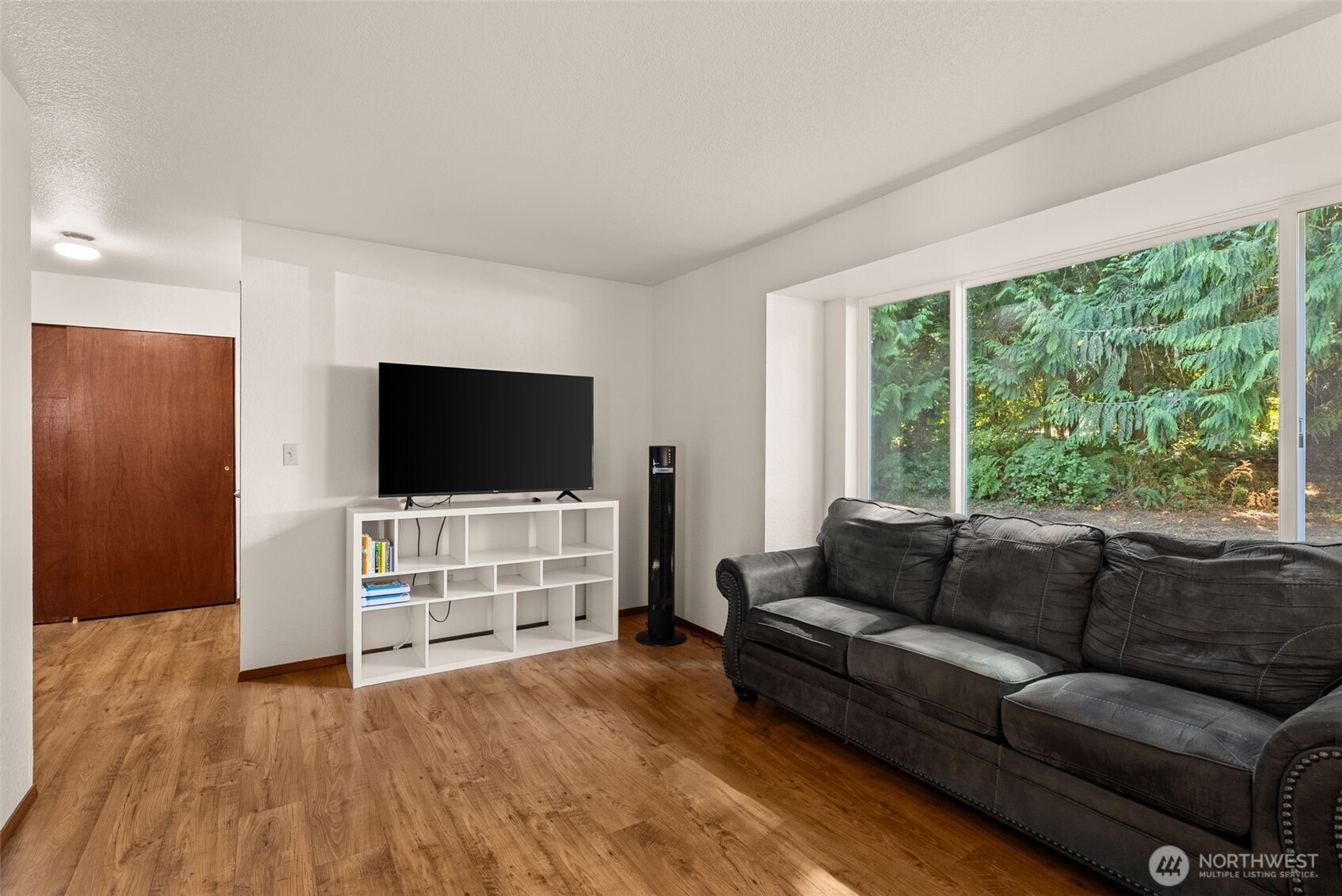 119 River Heights Road Centralia, WA 98531 - Photo 8 of 40 a living room with furniture and a flat screen tv