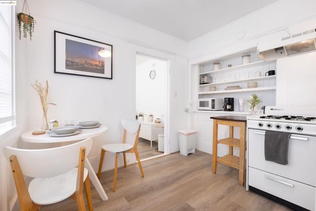 a dining room with furniture and wooden floor