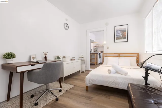 a bedroom with a bed and a table in it