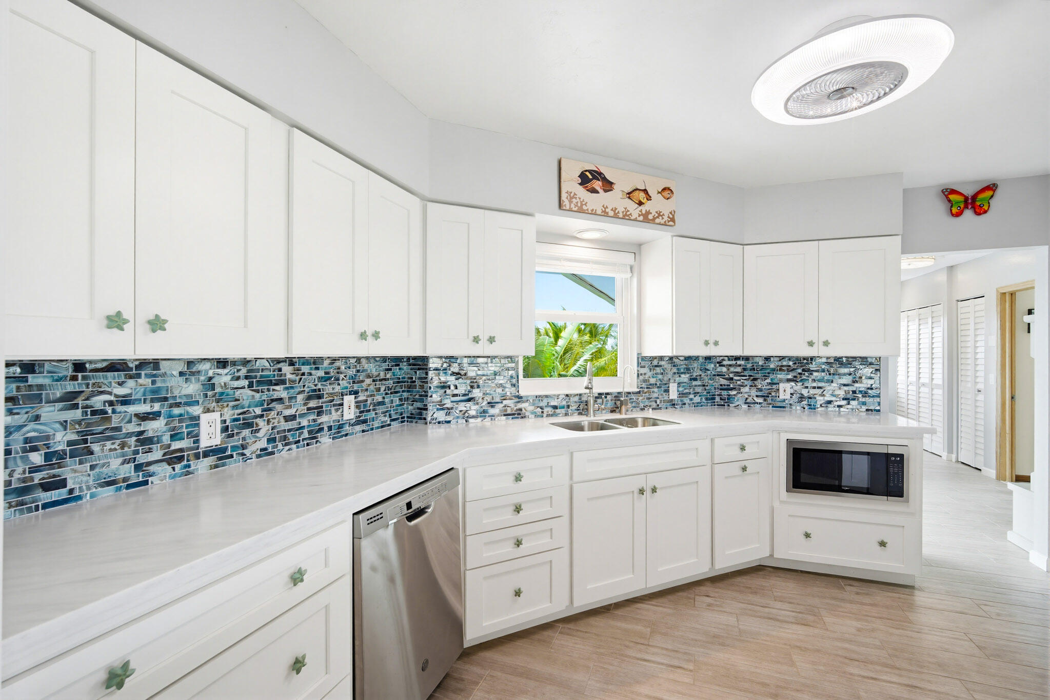 30463 Hawk Lane Big Pine Key, FL 33043 - Photo 16 of 64 a kitchen with granite countertop white cabinets and white appliances