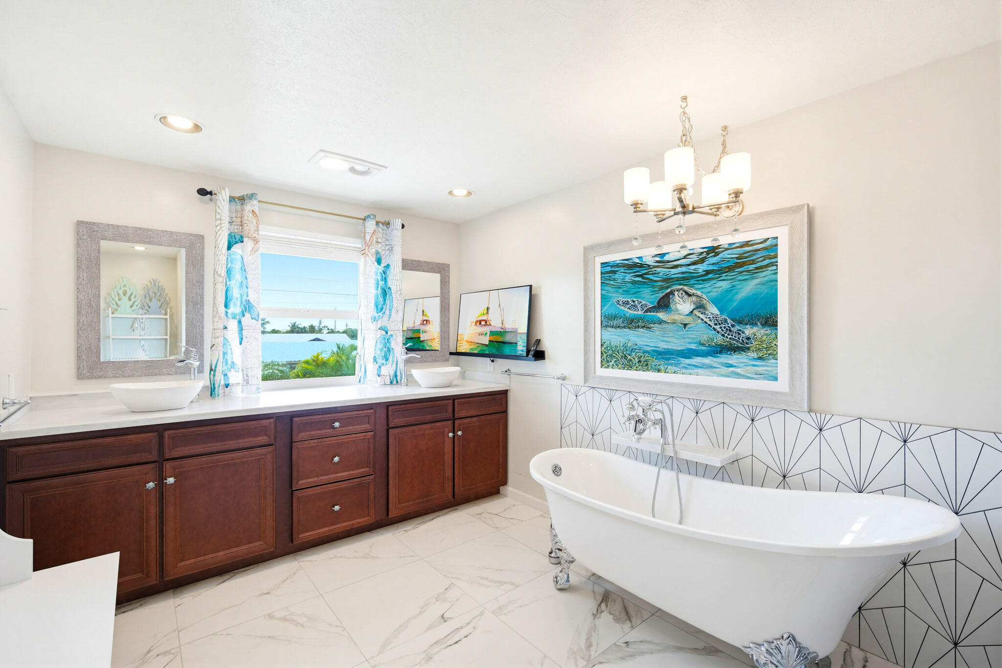 30463 Hawk Lane Big Pine Key, FL 33043 - Photo 30 of 64 a spacious bathroom with a tub a double vanity sink a window and a mirror