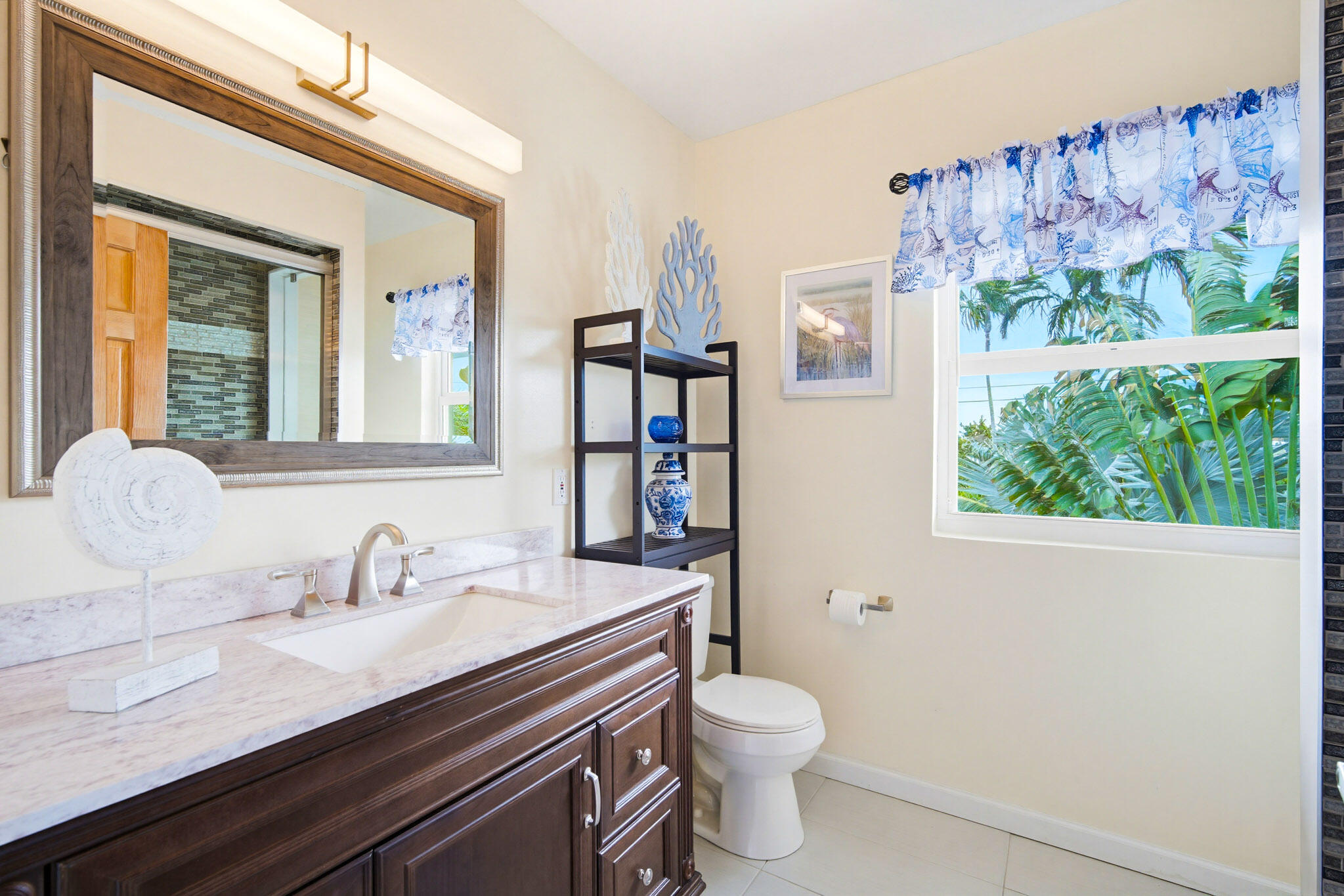 30463 Hawk Lane Big Pine Key, FL 33043 - Photo 34 of 64 a bathroom with a toilet sink and mirror