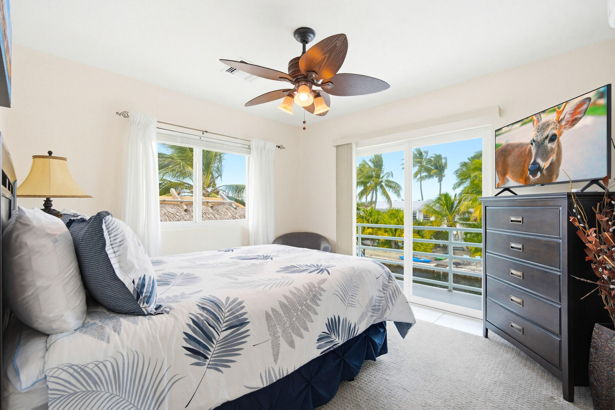 30463 Hawk Lane Big Pine Key, FL 33043 - Photo 36 of 64 a bedroom with a bed and a window