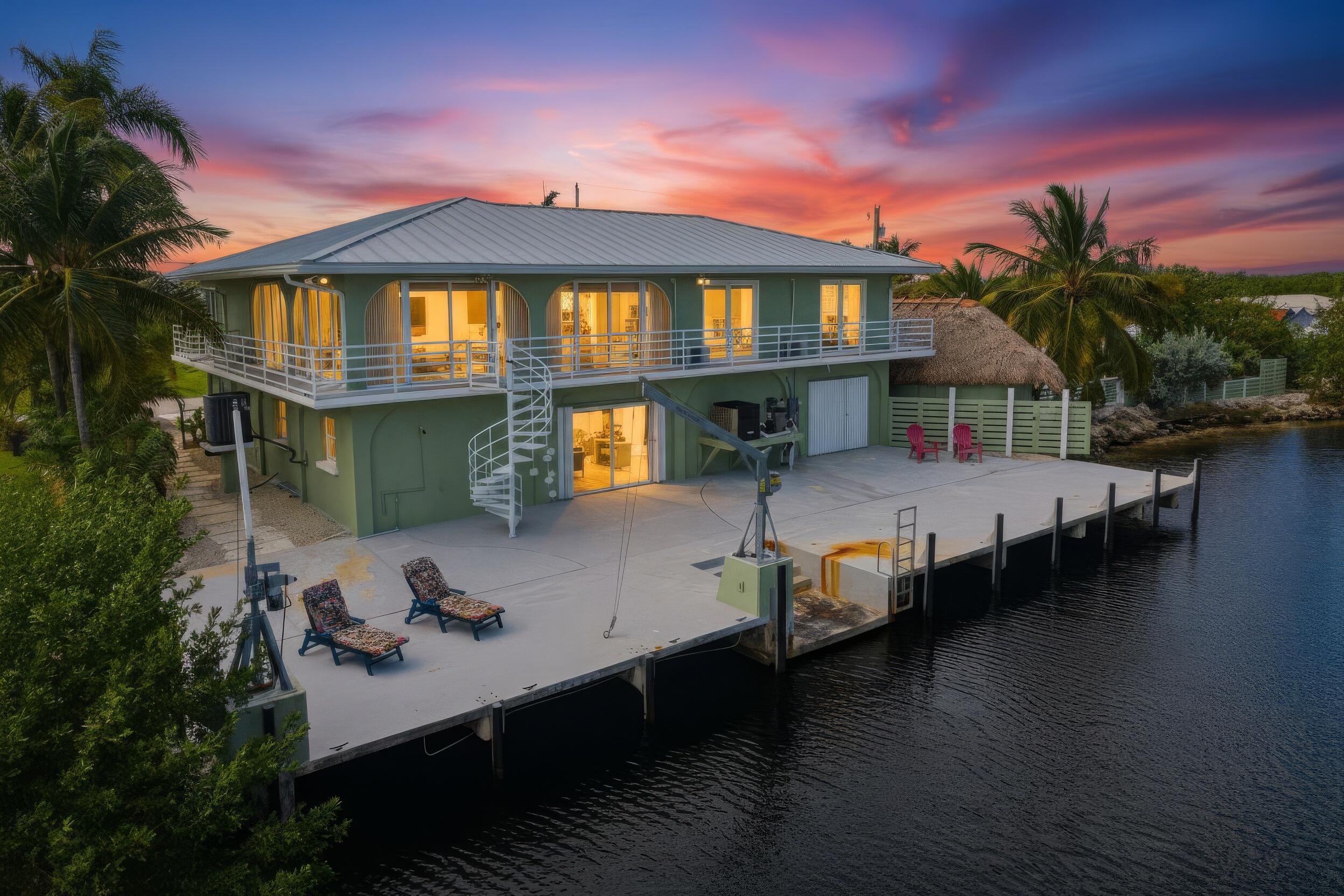 30463 Hawk Lane Big Pine Key, FL 33043 - Photo 55 of 64 a front view of a house with swimming pool