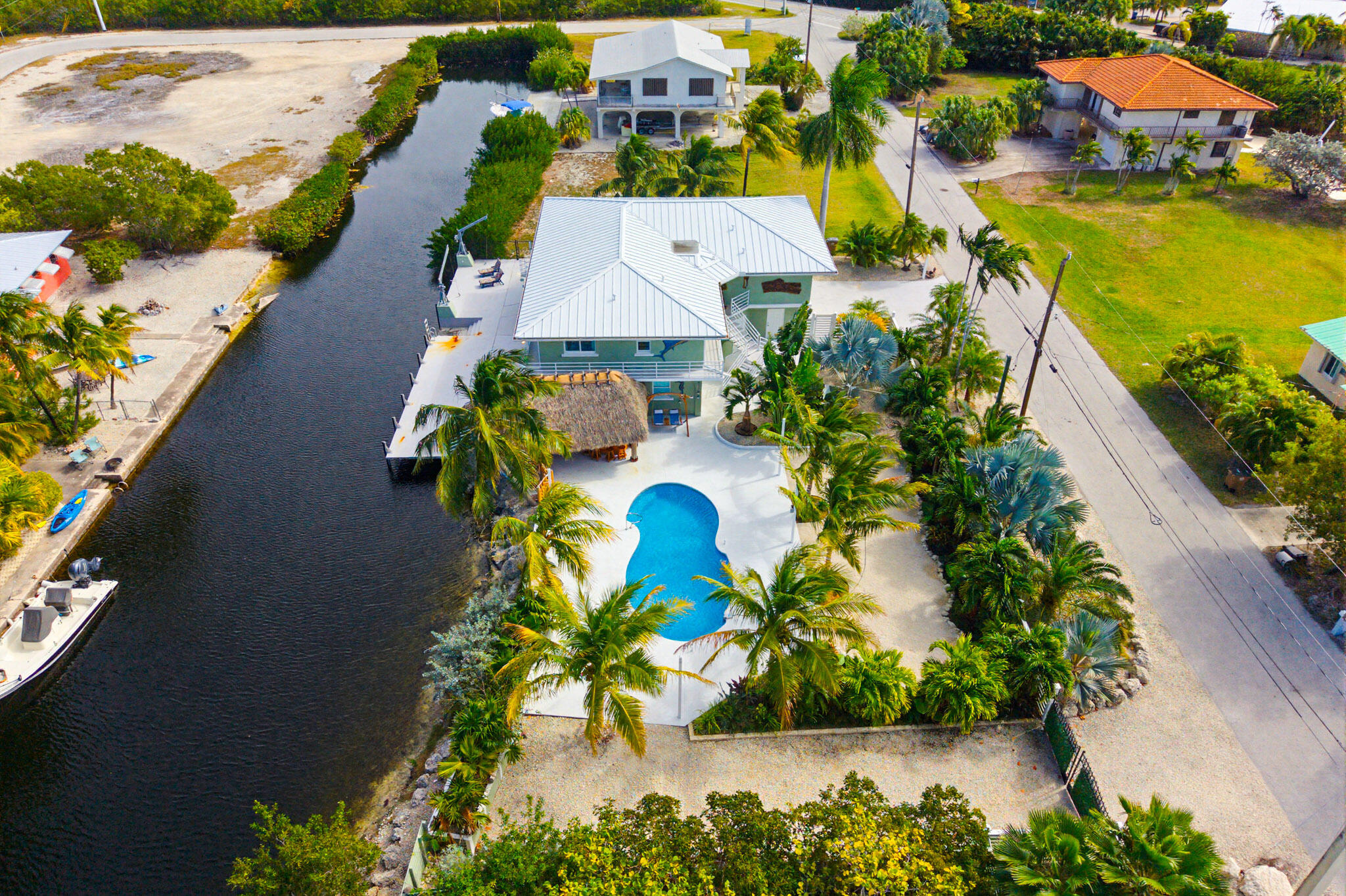 30463 Hawk Lane Big Pine Key, FL 33043 - Photo 6 of 64 an aerial view of a house with a garden and lake view