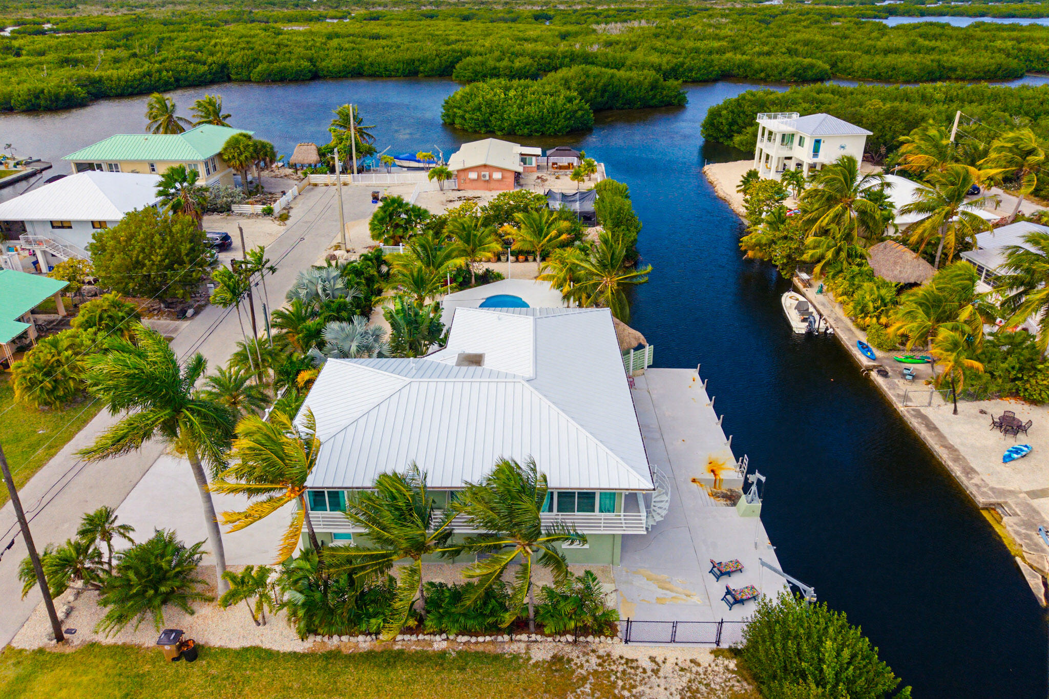 30463 Hawk Lane Big Pine Key, FL 33043 - Photo 7 of 64 an aerial view of a house with swimming pool and outdoor seating