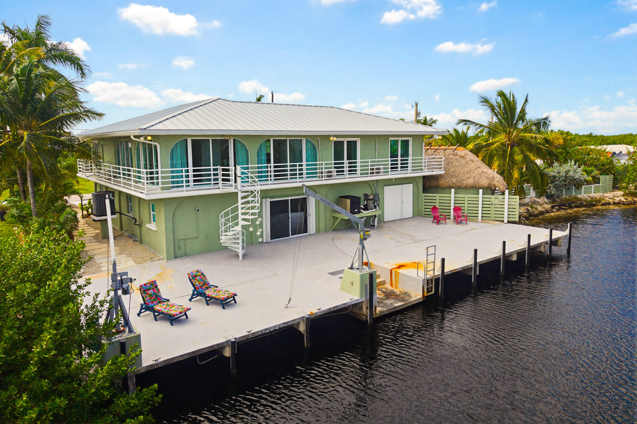 30463 Hawk Lane Big Pine Key, FL 33043 - Photo 9 of 64 a front view of a house with a yard