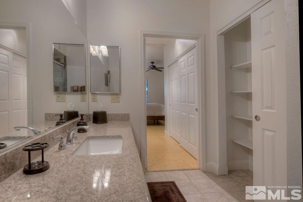 900 S, Unit 1414 Reno, NV 89521 - Photo 14 of 24 a bathroom with a sink and mirror