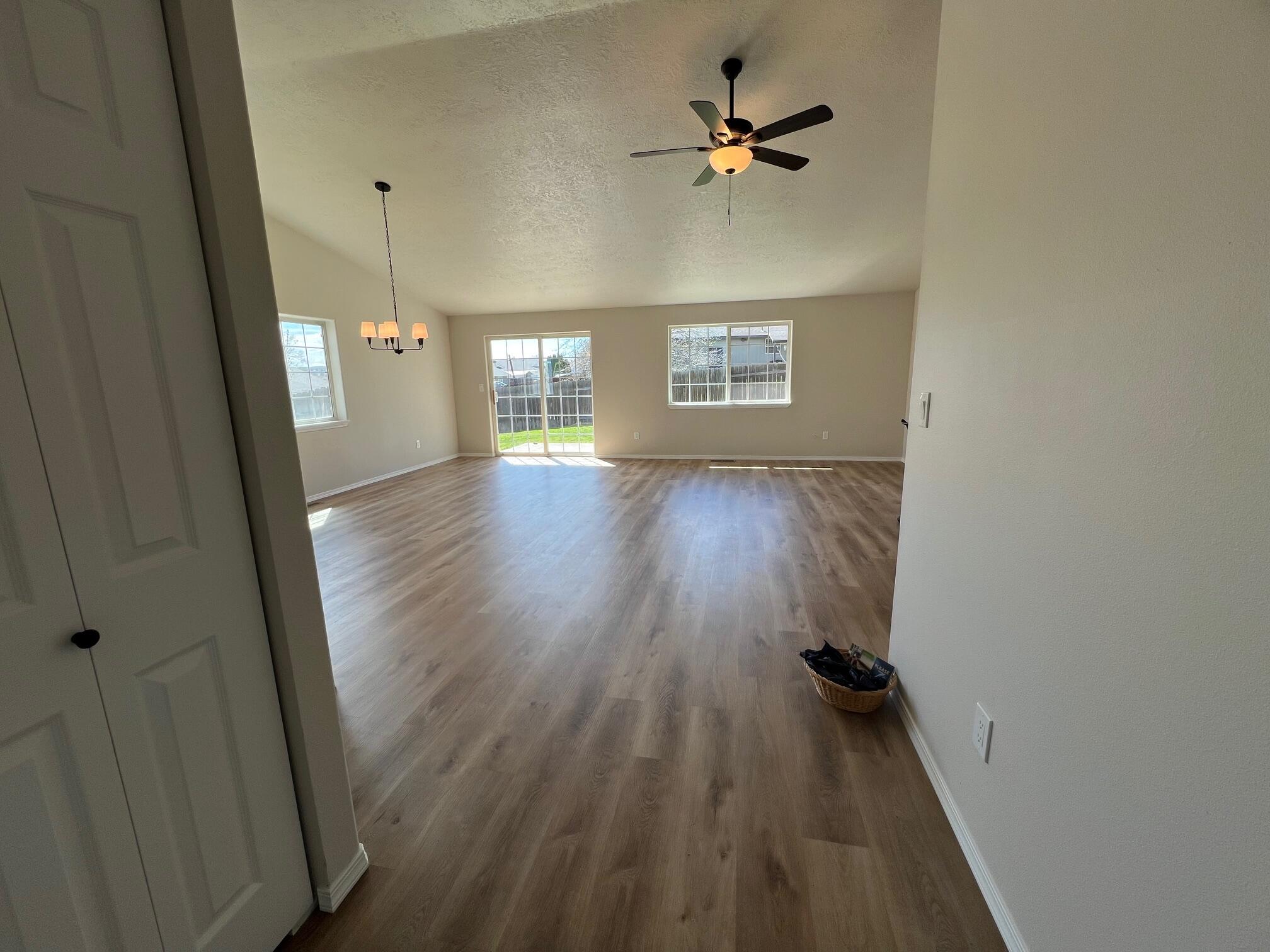 629 Deer Ridge Court Madras, OR 97741 - Photo 13 of 39 a view of empty room with wooden floor and fan